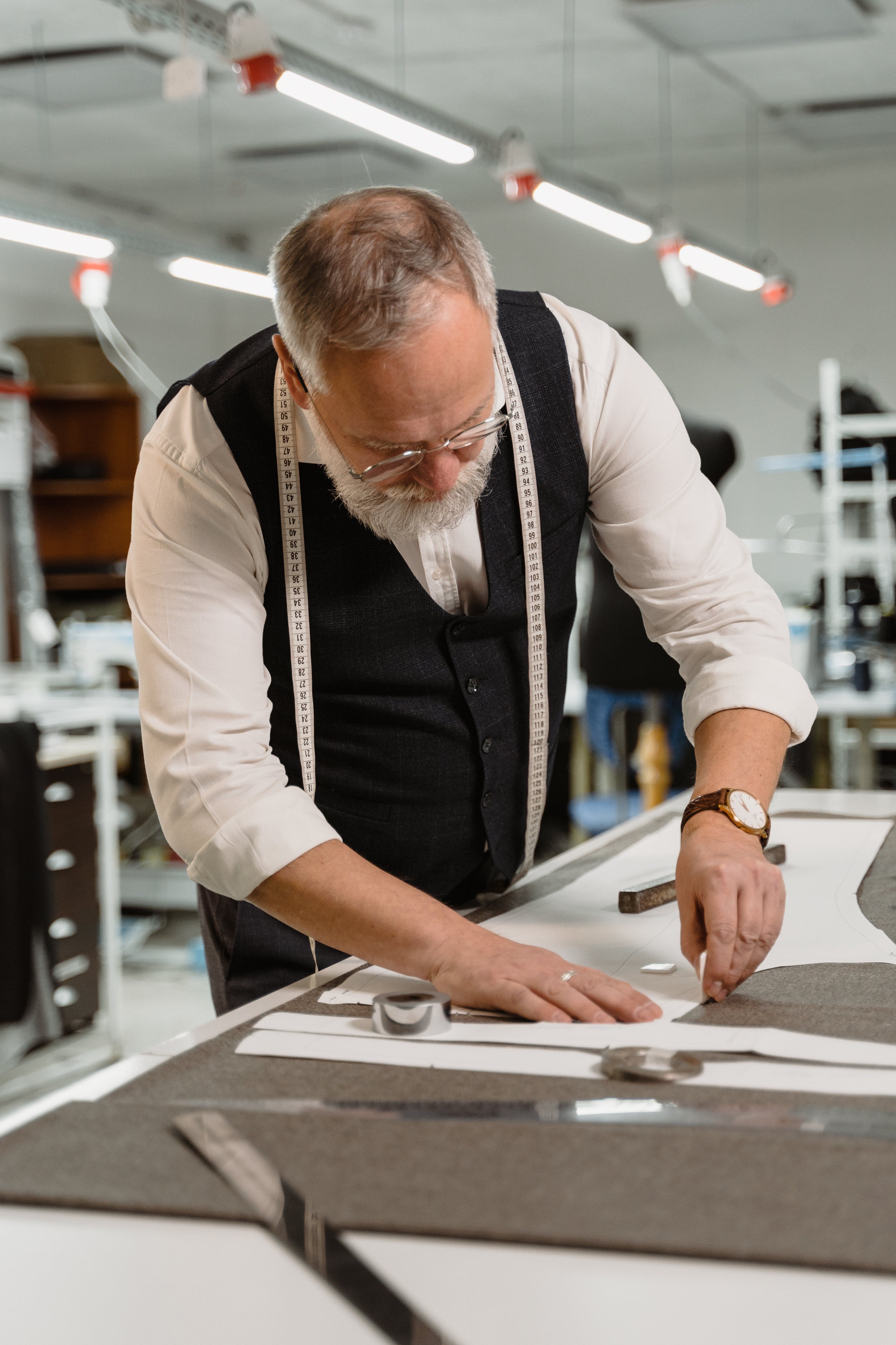 photo showing a fashion designer making sketches